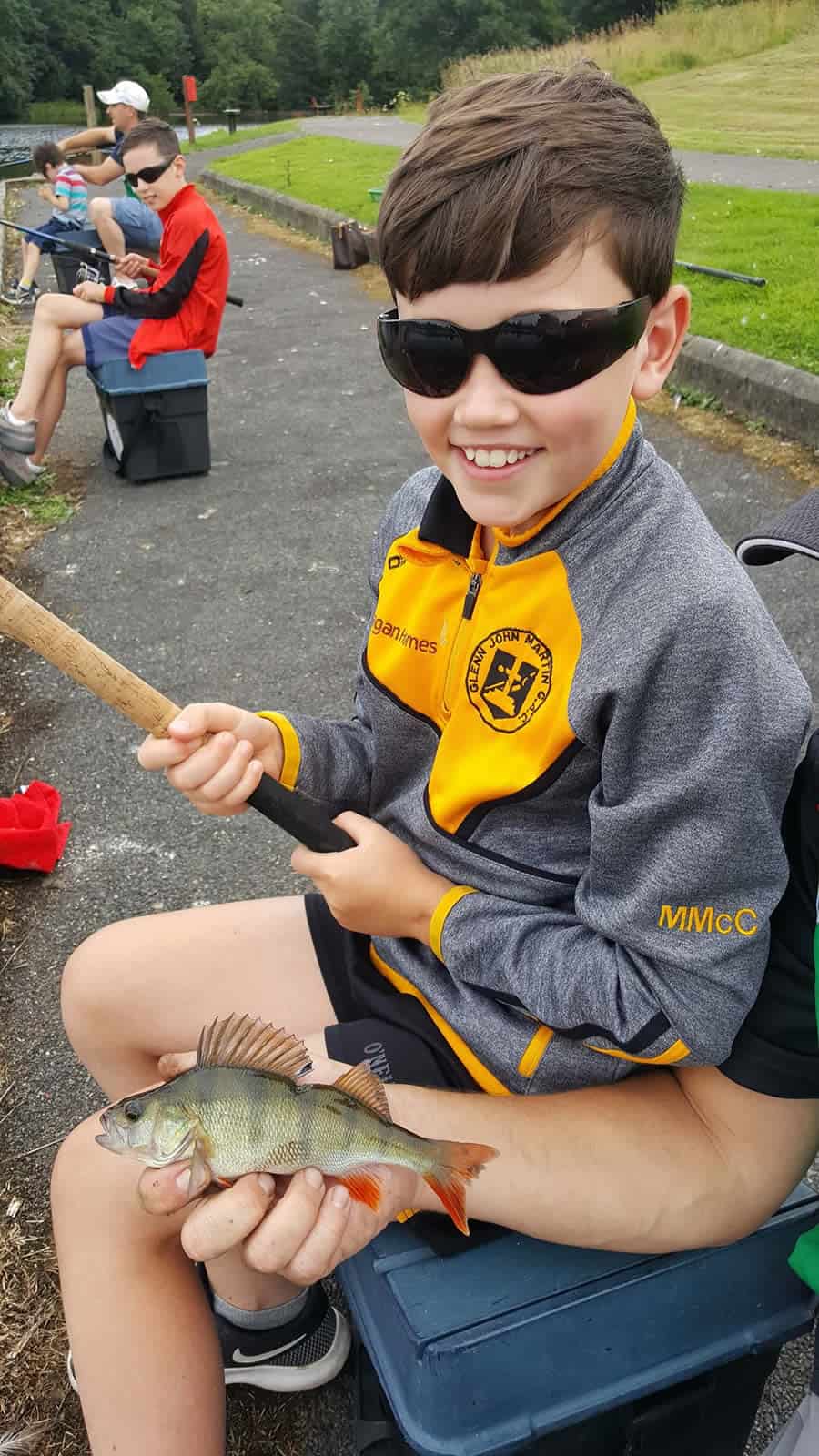 Fishing Event Boy Smiling With Fish